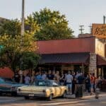 Exterior view of Arthur Bryant's Barbeque entrance with customers
