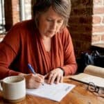 Diner completing Zagat survey inside cozy café