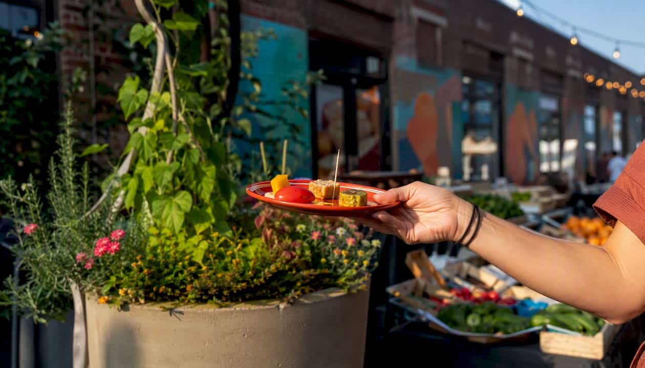 Food sample on plate during KC neighborhood tour