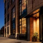 Converted Crossroads hotel exterior at dusk