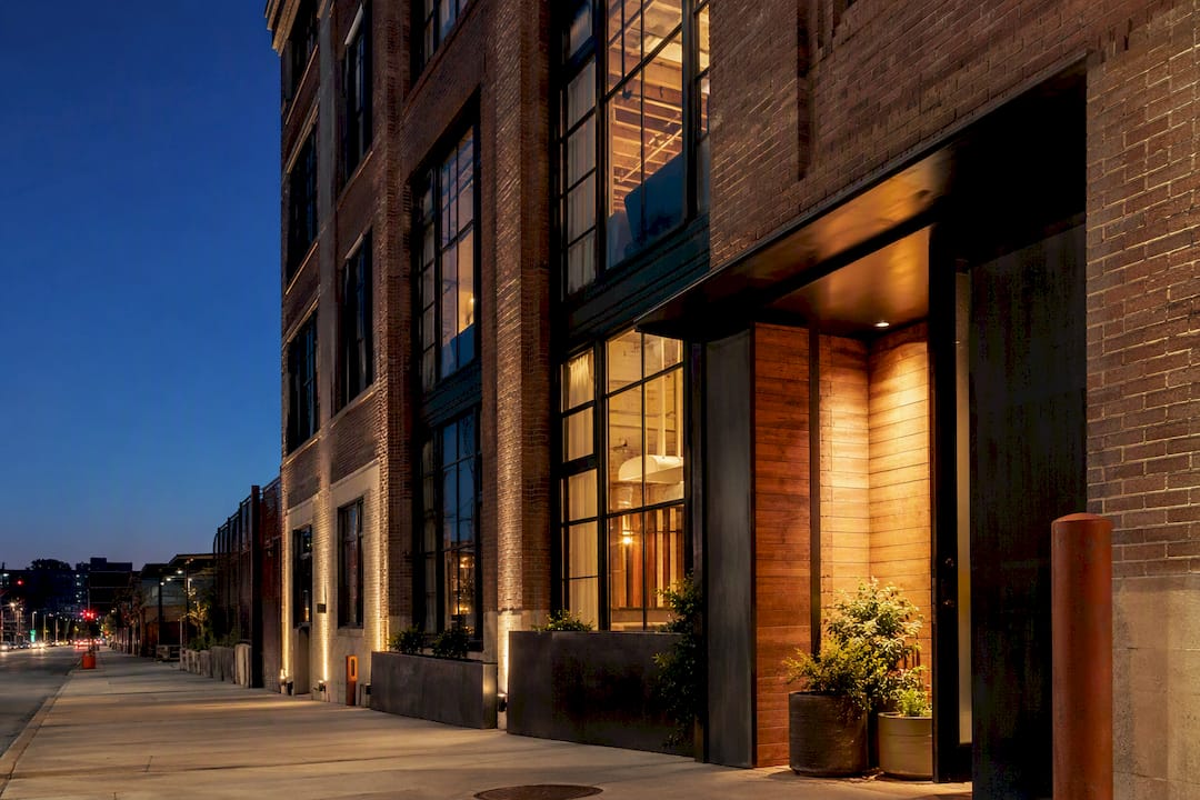 Converted Crossroads hotel exterior at dusk