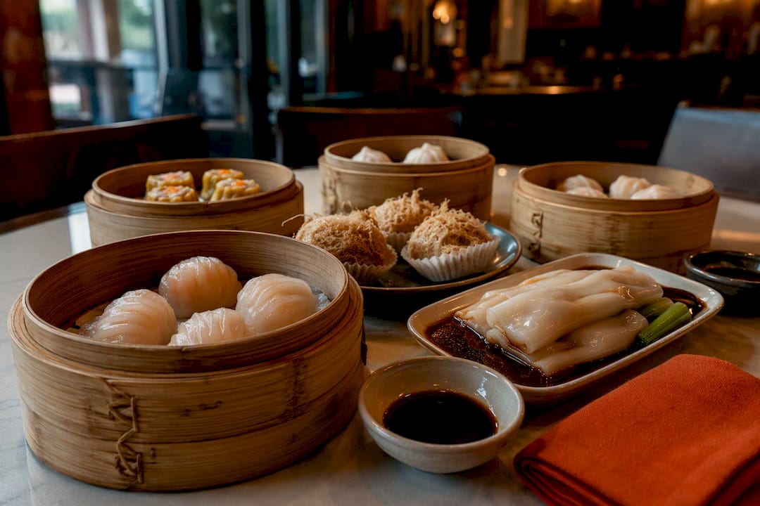 Dim sum baskets and plates on restaurant table
