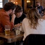 Friends debating answers at KC trivia night